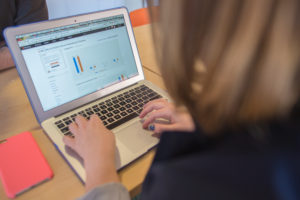 hands typing on laptop computer