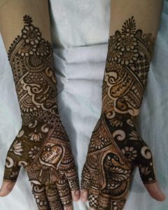 intricate Henna designs on hands and arms