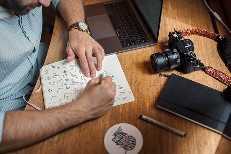 logo designer at his desk